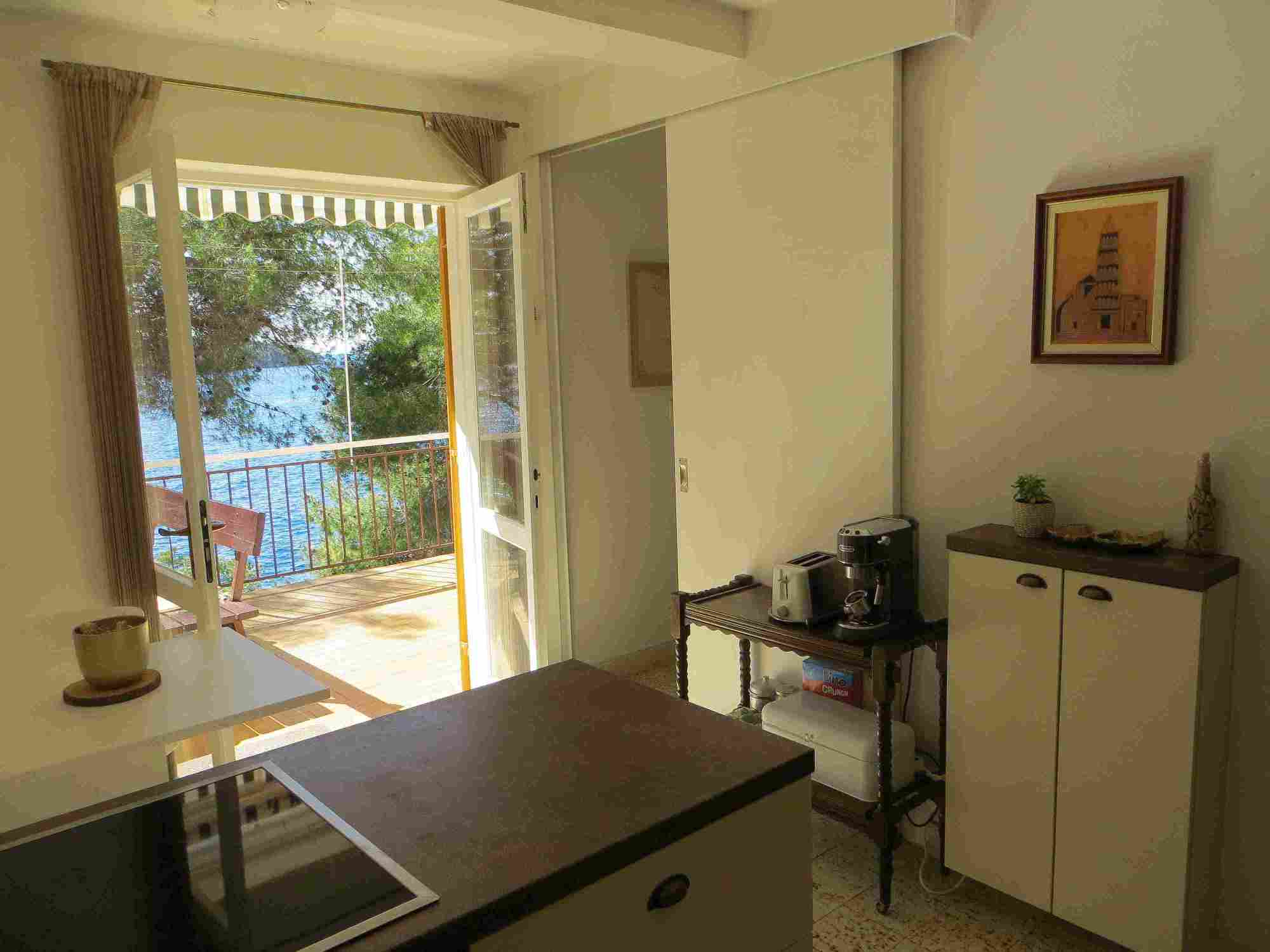 view from the kitchen and dining table at Villa V with seaside below