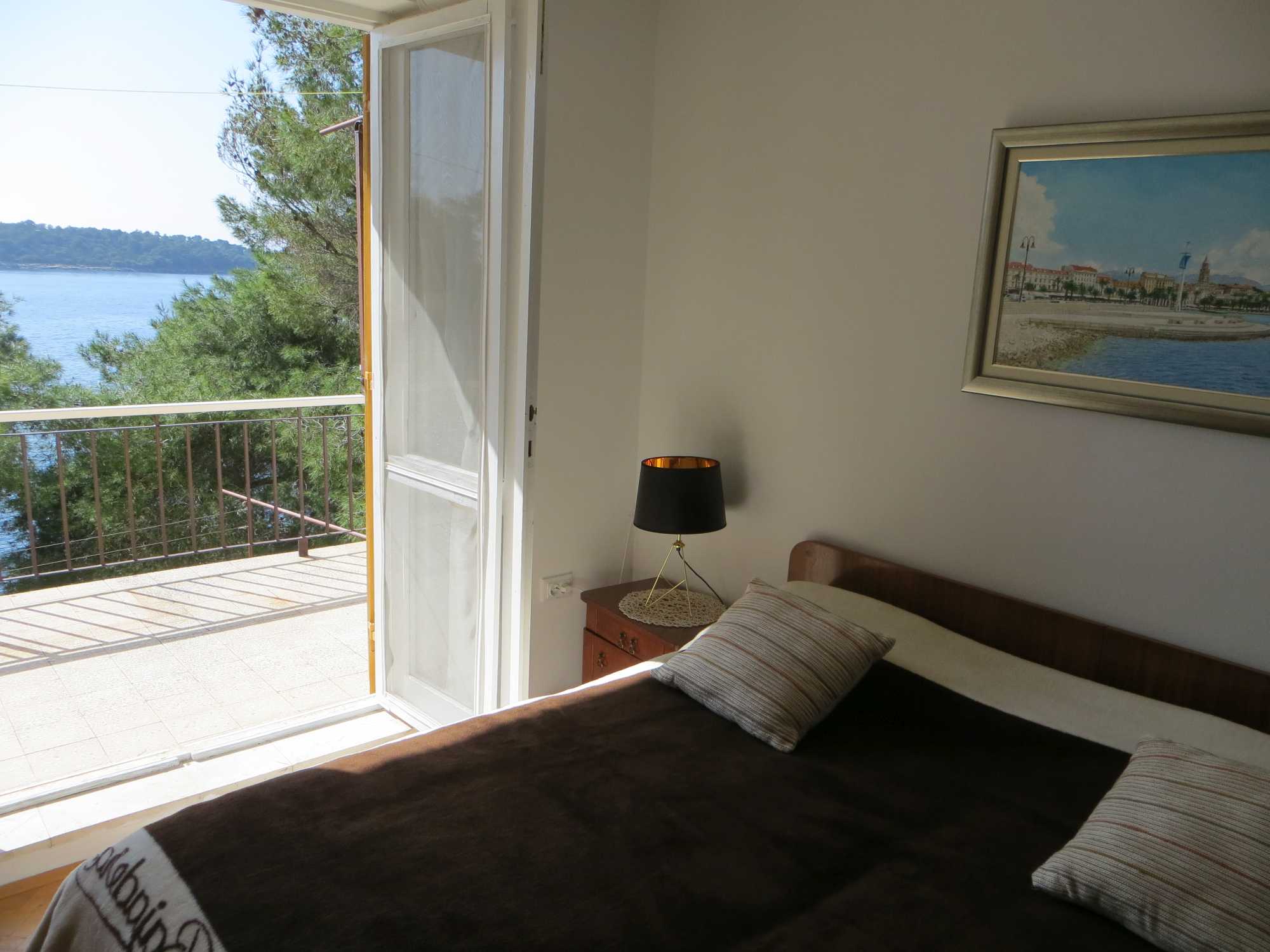 bedroom 2 with upper terrace, view of garden and seaside directly below